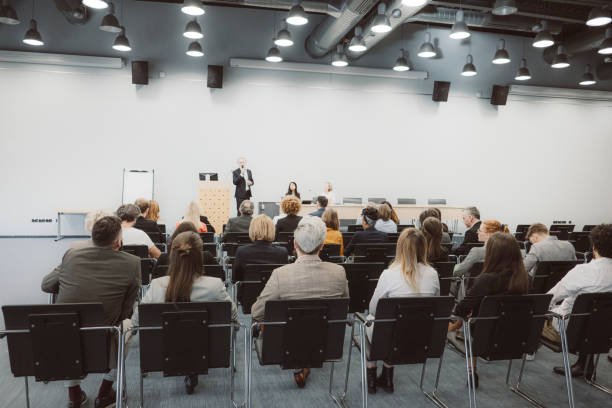 istock Business people sitting at seminar 1205193740