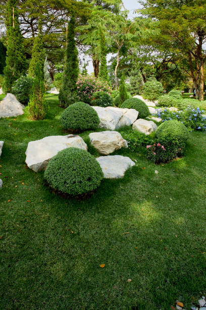 istock Backyard garden asian inspired paver patio with stone sculptures 1205193828
