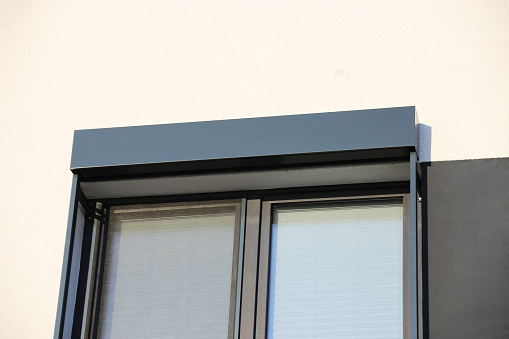 Window with porch roller shutter, exterior shot
