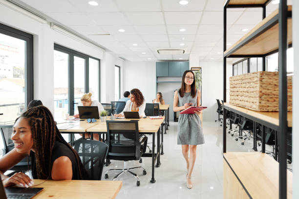 istock Businesswoman walking in office 1205201138