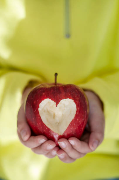 istock Red apple with heart symbol 1205203625