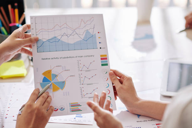istock Business people discussing report 1205204487