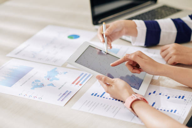 istock Businesswomen working on annual report 1205204513