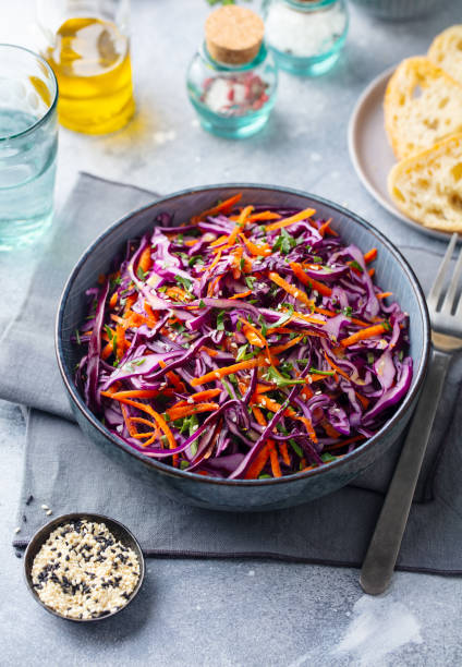 istock Red cabbage salad, Coleslaw in a bowl. Grey background. 1205205145
