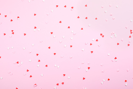 Valentine's day concept. Greeting card with pink hearts. Holiday minimal concept. Top view, flat lay.