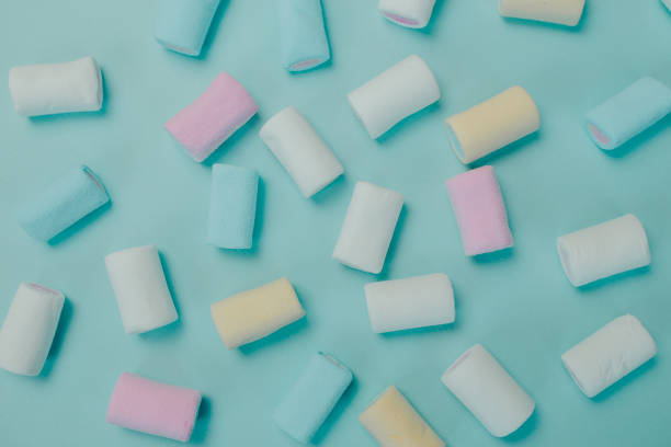 istock Colorful marshmallow on blue background. Many candies on the table. Pattern with marshmallow. 1205206321