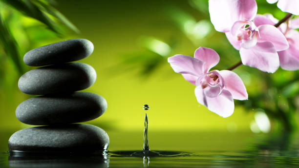 istock Dripping drops of water with black lava stones 1205206600