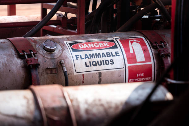 Flammable liquid storage tank. Flammable liquid (such as oil, fuel or hydraulic) container with standard caution sign on the body part. It's using in heavy industry and oil field operation. inlet photos stock pictures, royalty-free photos & images