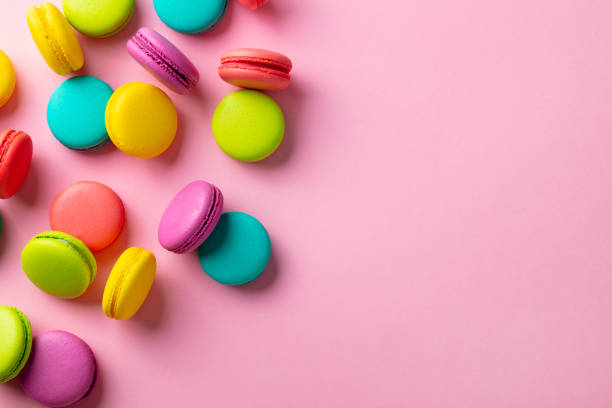 istock Macaroons dessert on pink background. Copy space. Top view. 1205209203