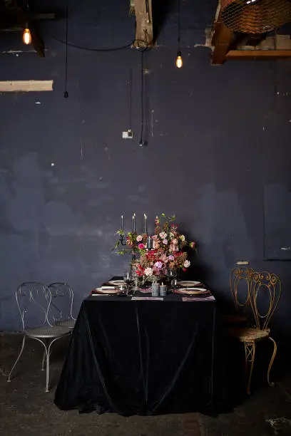 Images from an inspirational wedding shoot in a gothic style with flowers, jewelry, table decorations and stationery