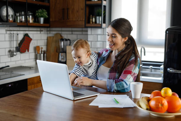 istock Young mother juggling work and child care 1205211843