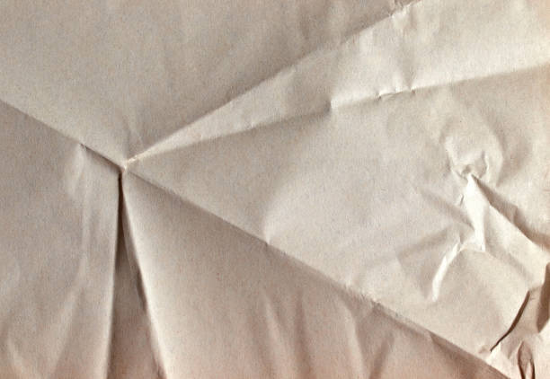 isolated blank crumpled sheet of paper as background texture bends