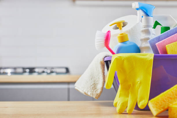 istock Cleaning set: sponge, bottle , glove, brush, spray on table and gray kitchen background 1205213445