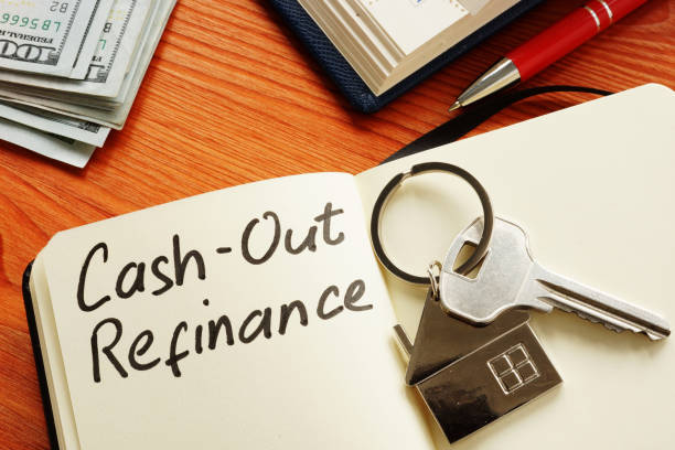 istock Cash out refinance and key on the notepad. 1205213932