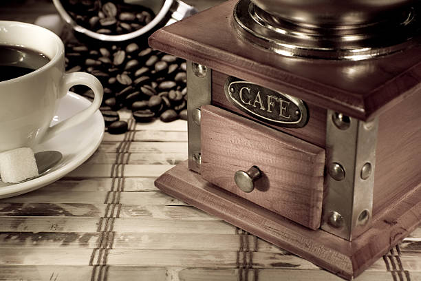 istock cup of coffee, pot and grinder on vintage 120521403