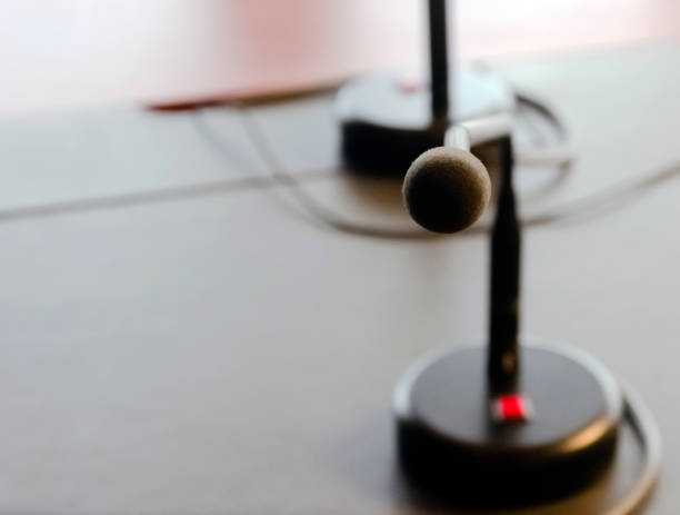 istock a table microphone on the wooden table of a board. 1205215680