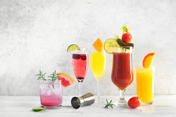 Brunch or Breakfast Cocktails Assortment Brunch or Breakfast Cocktails Assortment. Bloody Mary, Mimosa drinks and various citrus alcohol refreshing cocktails on white table, copy space. bloody mary stock pictures, royalty-free photos & images