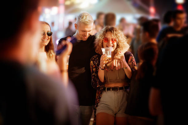 istock Friends walking together amidst crowd 1205220194