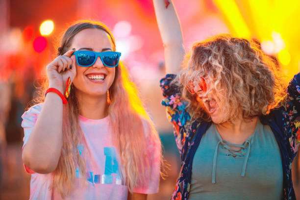 istock Festival goers dancing during music festival 1205220351