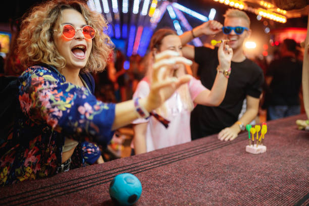 istock Friends having fun at amusement park 1205220403