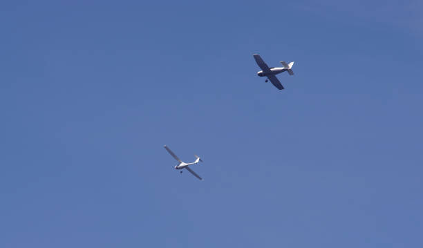 istock two airplanes flying in the blue sky 1205221178