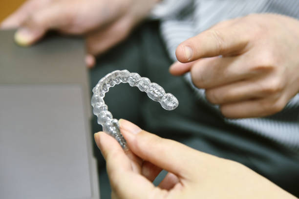 istock Inivisalign braces or aligner. Dentist advice how invisible orthodontics make beautiful teeth in dental clinic. 1205221399