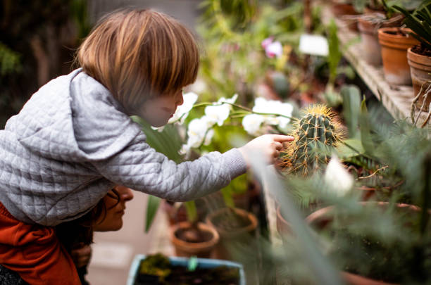istock Mother and kid at the botanical garden 1205223216