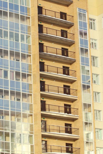 istock Plastic windows in a modern tiled brick high-rise house 1205223404