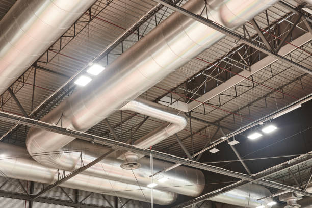 istock Warehouse building roof stainless air pipes. Ventilation structure equipment 1205223460