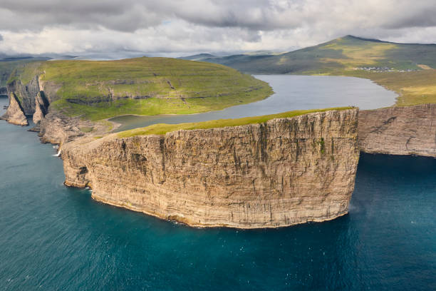 istock Faroe islands dramatic coastline in Vagar. Leitisvatn lake 1205223480