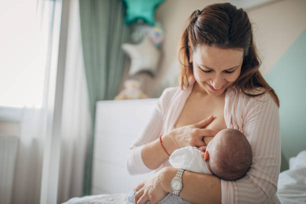 istock Mother breastfeeding her baby boy at home 1205223540