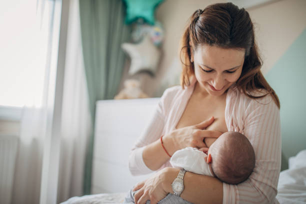 istock Mother breastfeeding her baby boy at home 1205223566