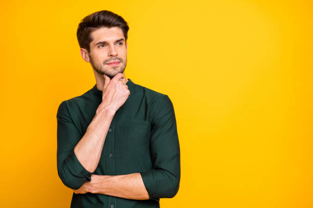 istock Portrait of gorgeous brutal masculine worker think try solve work job problems touch his chin wear casual outfit isolated over bright color background 1205224257