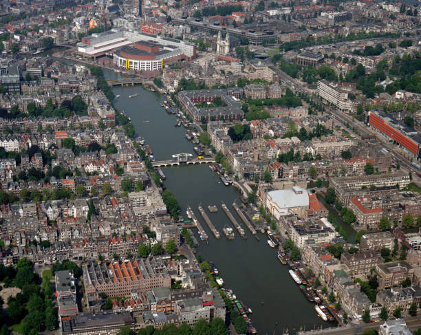 Amsterdam, Holland, August 24 - 1987: Historical aerial photo of the Stopera, Amsterdam,Holland Amsterdam, Holland, August 24 - 1987: Historical aerial photo of the Stopera and the river Amstel, Amsterdam,Holland stopera stock pictures, royalty-free photos & images