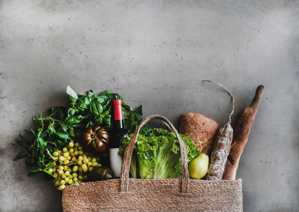 flat-lay of healthy grocery shopping bag with food and wine - salad food and drink food lettuce imagens e fotografias de stock