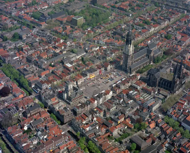 Delft, Holland, May 17 - 1985: Historical aerial photo of the New Church, Nieuwe kerk and Old Church, Oude Kerk in Delft, Holland