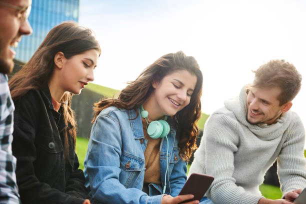 istock Cheerful friends having happy time outdoors 1205226054