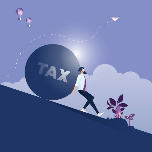 istock Businessman carrying and making effort to push up big stone with TAX message 1205228921
