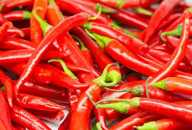 Red hot peppers with a price tag on the counter