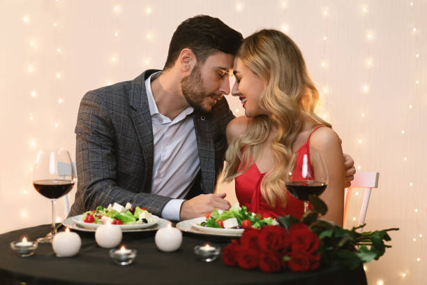 istock Loving Young Couple Bonding On Romantic Date In Restaurant 1205233482