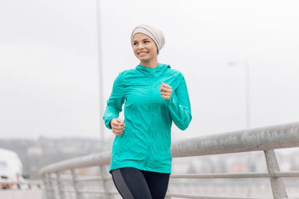 istock Woman running and enjoying 1205233557