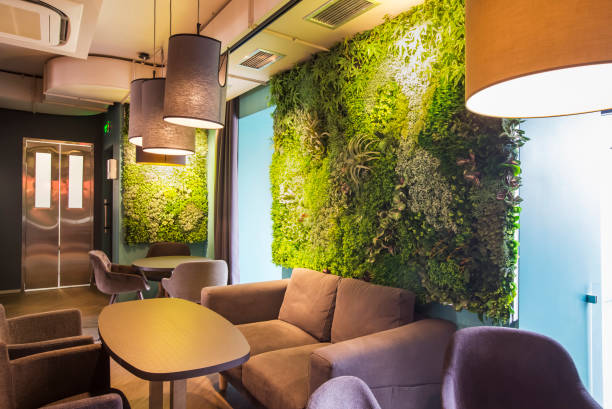 istock Green plants wall ornamental design on the wall in eco coffee cafe 1205234008