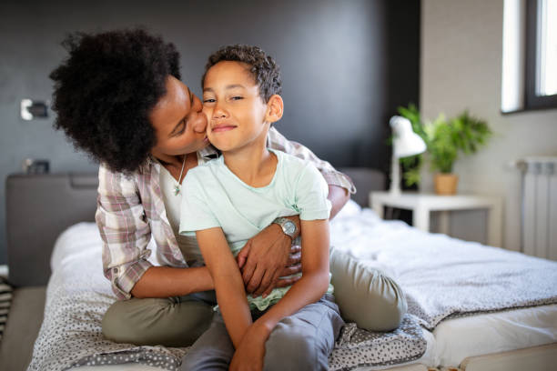 istock Mother playing bonding hugging with her son. Happy family time. 1205235088