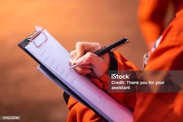 Writing Note On Paper Audit And Inspection In Oil Field Operation Stock Photo - Download Image Now