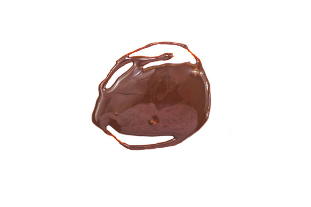 istock Spot, splashes of liquid chocolate, cocoa with milk on a white background 1205235920