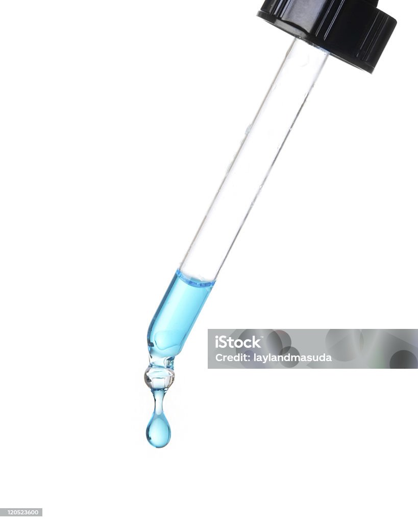 Blue Drop Of Liquid From Glass Dropper  Pipette Stock Photo