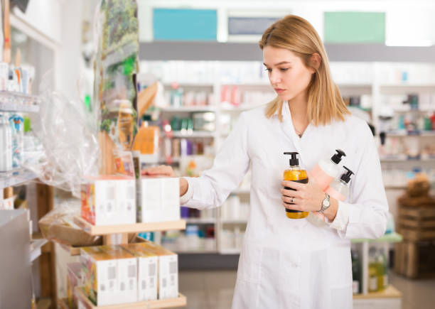 istock Woman pharmacist arranging drugs 1205239087