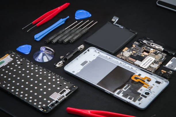 istock Repairman workplace with disassembled smartphone 1205239751