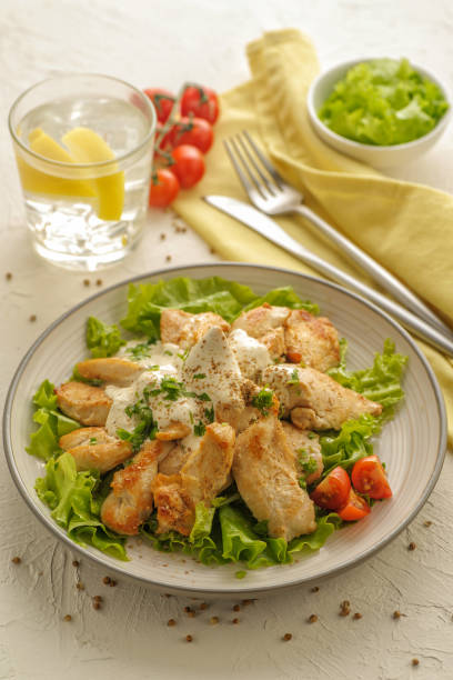 istock Fresh vegetable and chicken salad with cream dressing and coriander. 1205242724