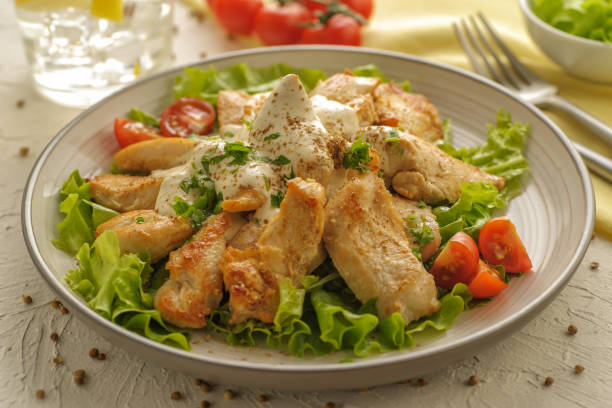 istock Fresh vegetable and chicken salad with cream dressing and coriander. 1205242776